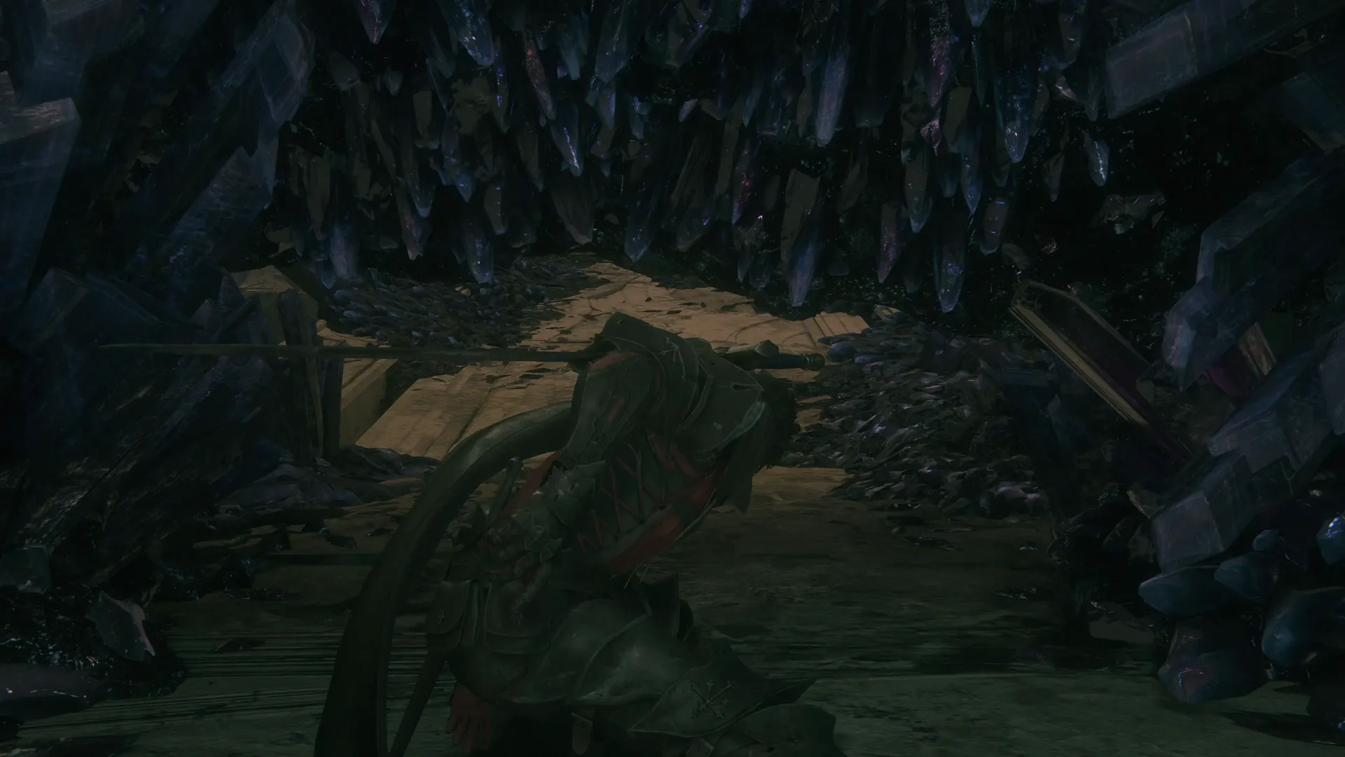 Clive ducking under a collection of crystals as he goes through the Gallery towards the first boss